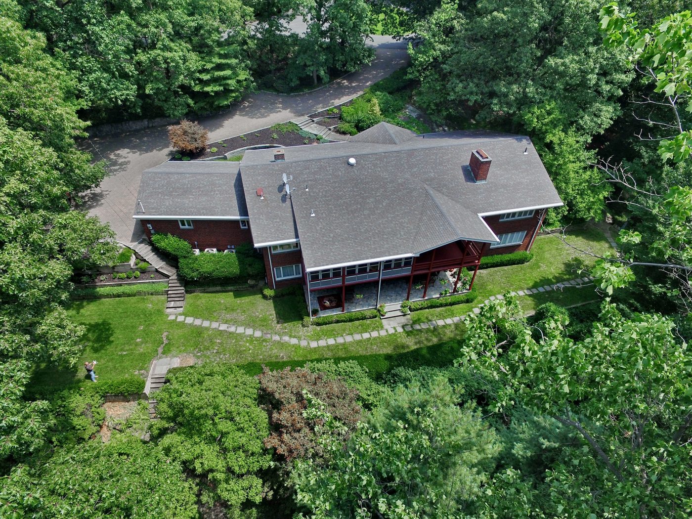 Aerial view of the 1.6-acre wooded setting