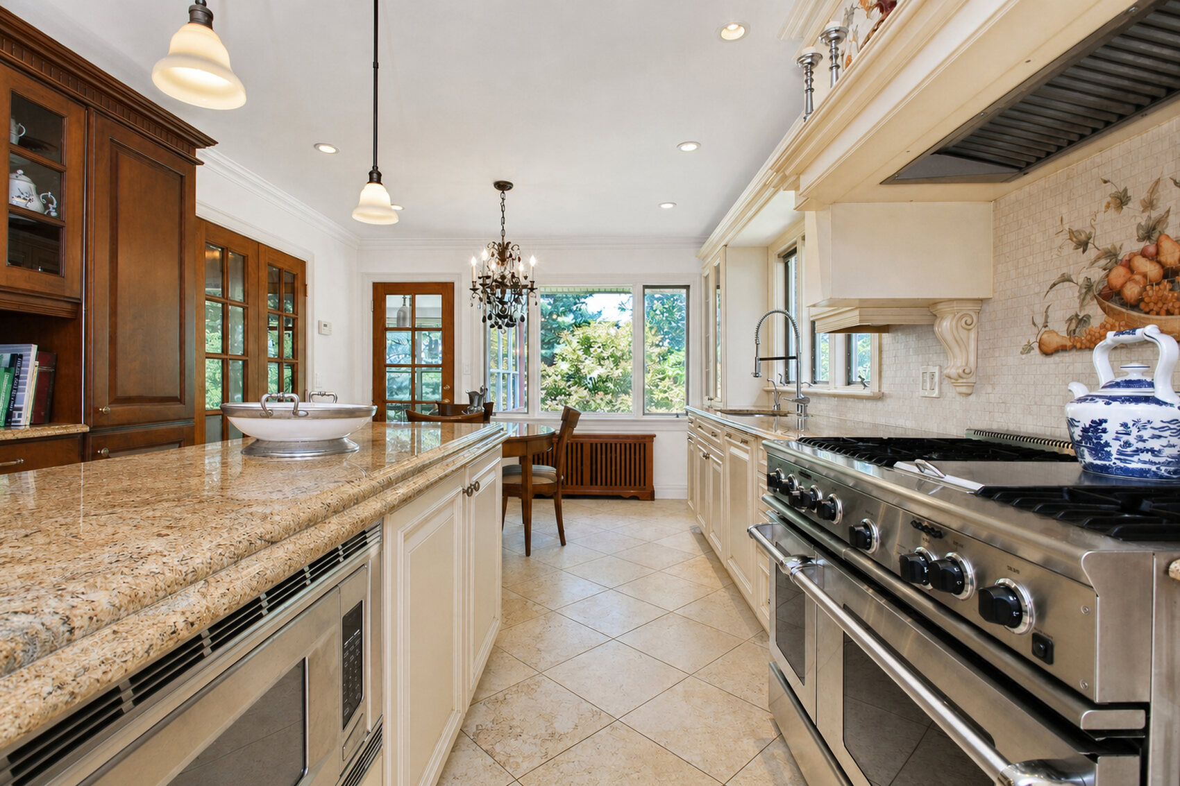 Kitchen with professional range and granite counters