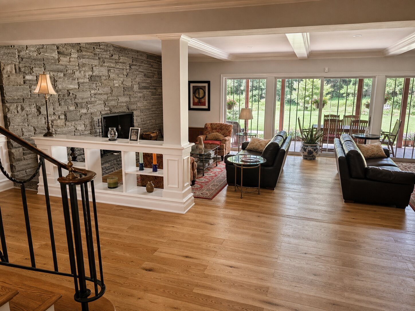 Lower level living room with stone fireplace