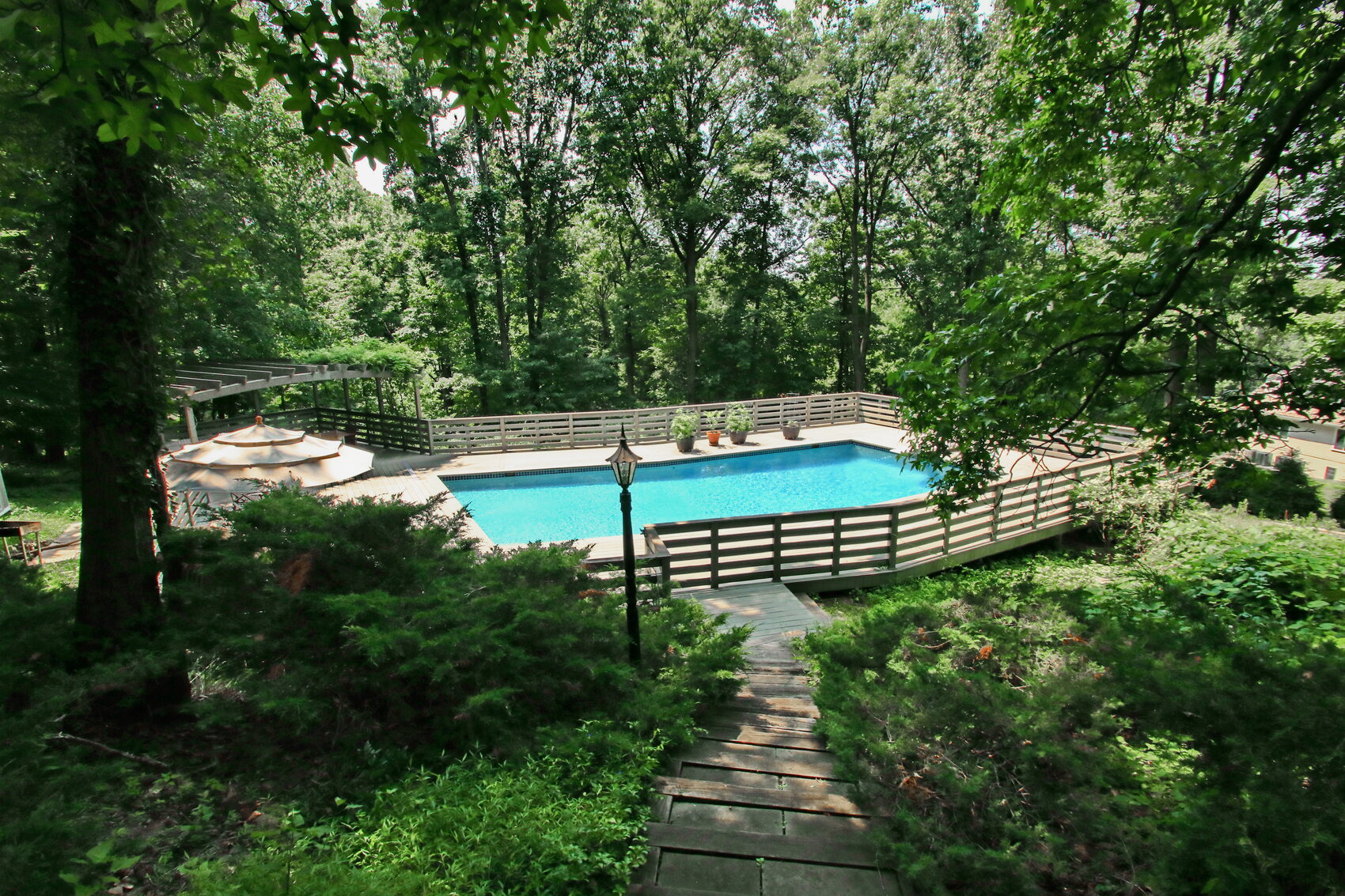Outdoor pool with surrounding deck